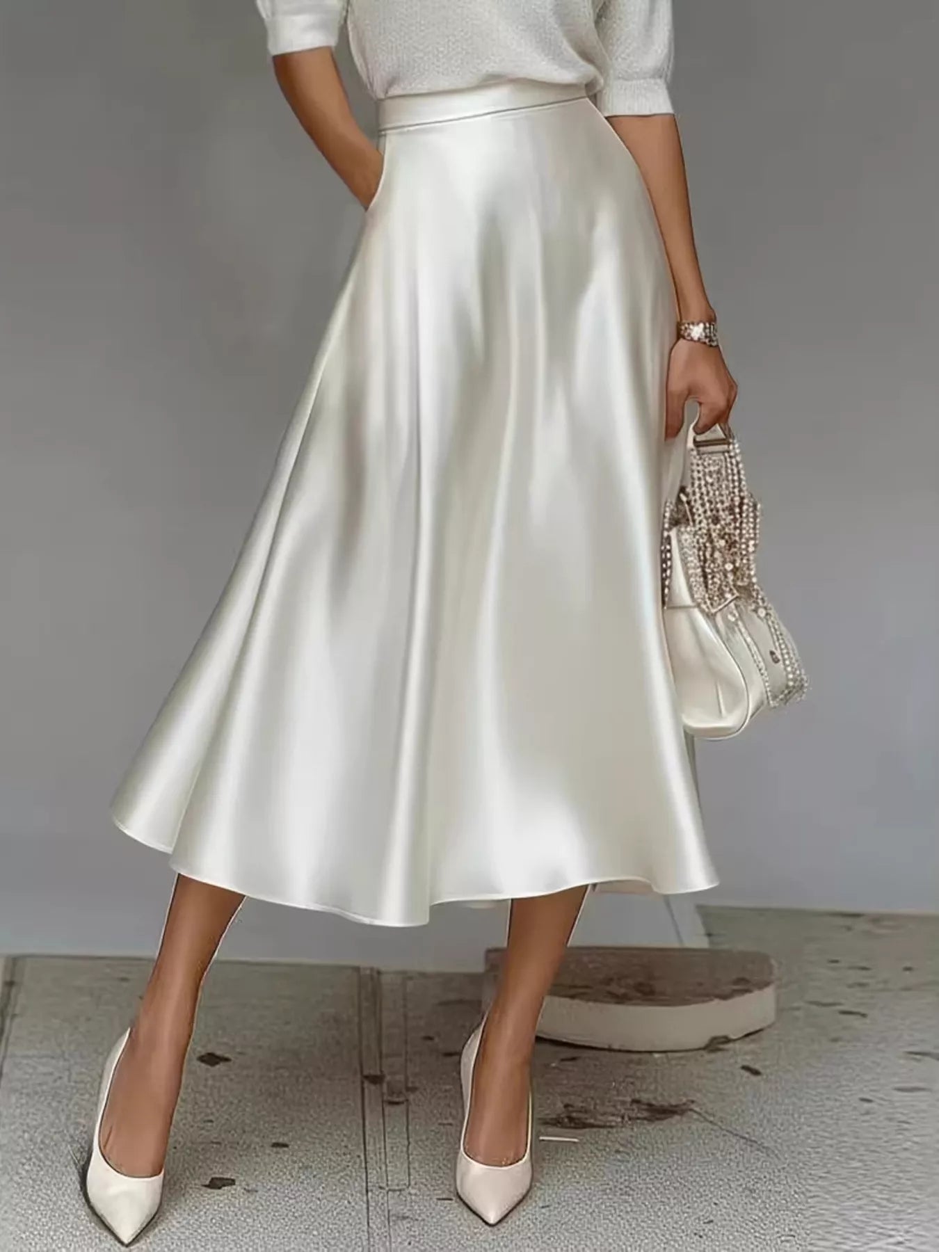 White satin midi skirt with gathered waist and A-line flare hem
