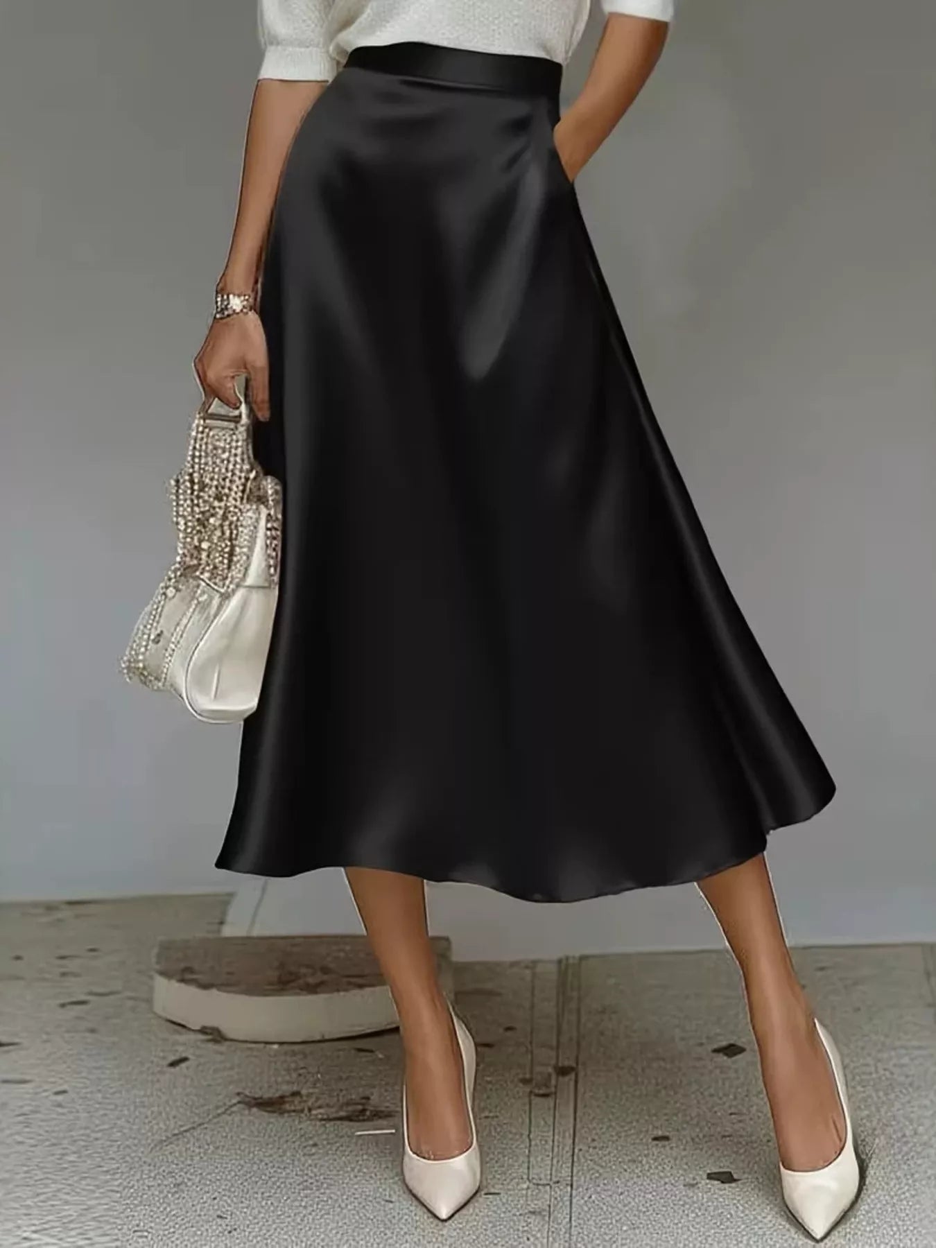 Black satin midi skirt with gathered waist and A-line flare hem