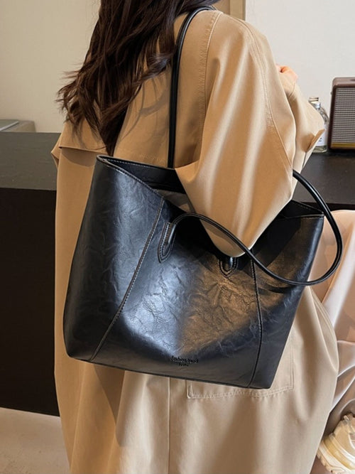 Leather tote bag, black with long shoulder straps and front zip pocket